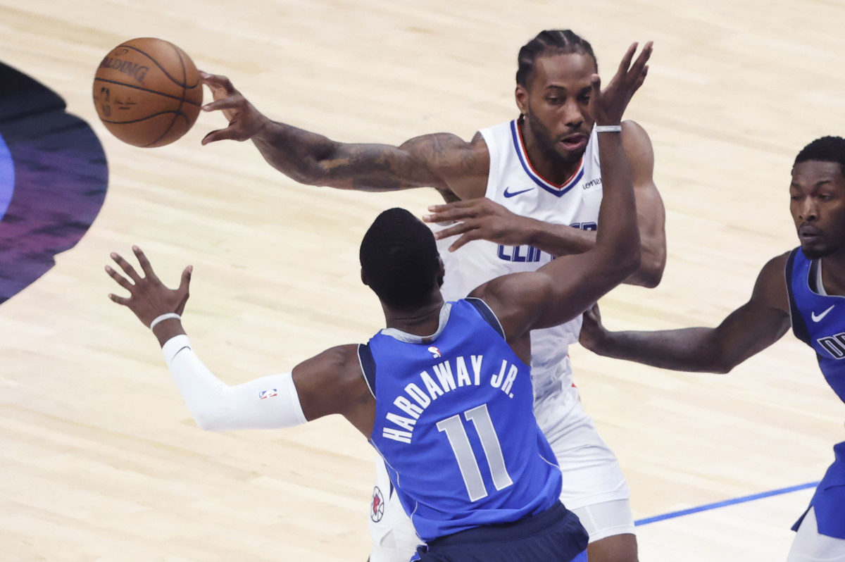 Jun 4, 2021; Dallas, Texas, USA; LA Clippers forward Kawhi Leonard (2) passes past Dallas Mavericks forward Tim Hardaway Jr. (11) during the third quarter during game six in the first round of the 2021 NBA Playoffs at American Airlines Center. Mandatory Credit: Kevin Jairaj-USA TODAY Sports